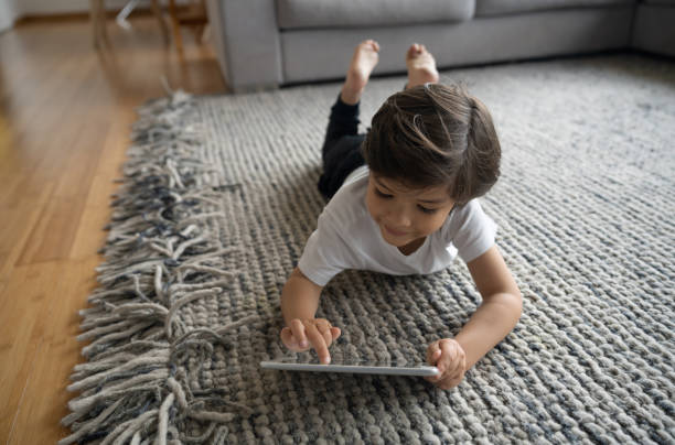 Girl lying on rug flooring