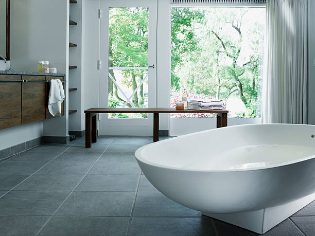 Bathroom tile with bath tub | Color Interiors