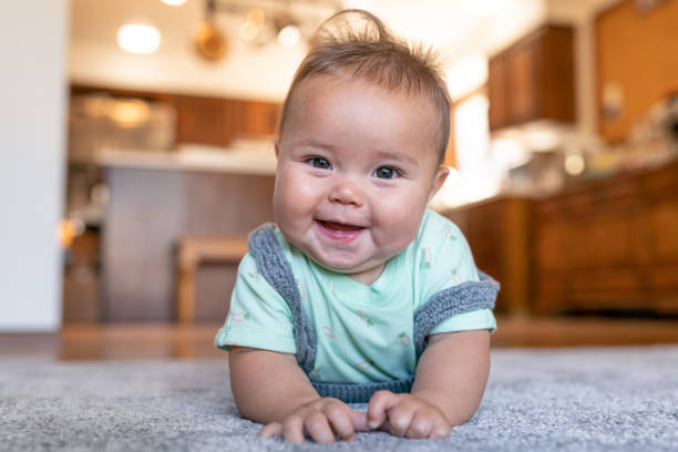 Baby lying on rug